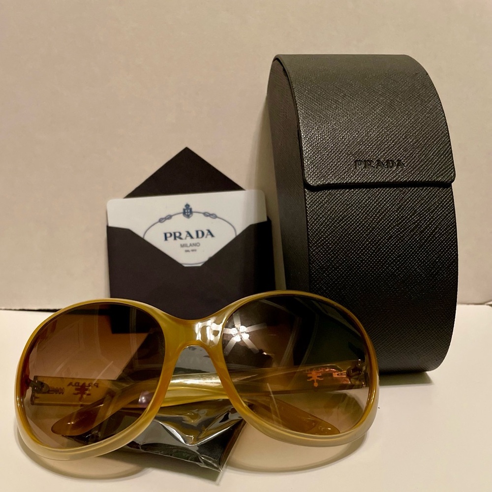 Timeless, chic, and classic. PRADA SPR04O Sunglasses in color GAD6S1